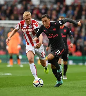 Mesut Ozil vs Darren Fletcher: A Premier League Battle at Bet365 Stadium