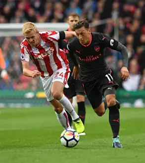 Mesut Ozil vs Darren Fletcher: A Premier League Battle at Bet365 Stadium