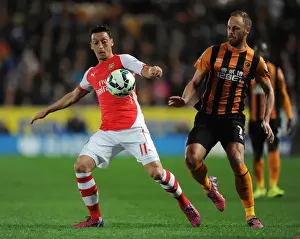 Hull City V Arsenal 2014/15 Prints: Mesut Ozil vs David Meyler: Intense Battle at KC Stadium
