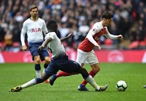Tottenham Hotspur v Arsenal 2018-19 Collection: Mesut Ozil vs. Davison Sanchez: Battle at Wembley - Premier League Showdown