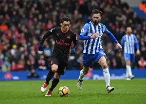 Mesut Ozil vs. Davy Propper: Intense Battle in Brighton and Hove Albion vs. Arsenal Premier League Clash
