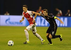 Dinamo Zagreb v Arsenal 2015-16 Collection: Mesut Ozil vs. Domagoj Antolic: Tense Clash in Dinamo Zagreb vs