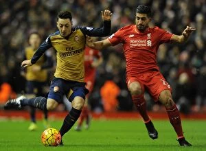 Images Dated 13th January 2016: Mesut Ozil vs. Emre Can: A Premier League Battle at Anfield, 2015-16