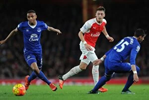 Images Dated 24th October 2015: Mesut Ozil vs Everton's Defense: A Battle of Wits in the Arsenal vs Everton Premier League Clash