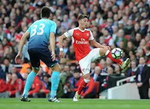 Arsenal V Swansea City 2016-17 Prints: Mesut Ozil vs Federico Fernandez: A Battle of Midfield Maestros in Arsenal vs Swansea City