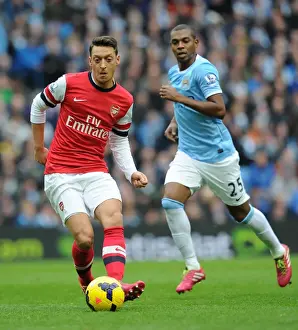 Manchester City V Arsenal 2013-14 Prints: Mesut Ozil vs Fernandinho: Intense Midfield Battle at Manchester City vs Arsenal (2013-14)
