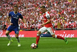 Arsenal V Chelsea - FA Cup Final 2017 Prints: Mesut Ozil vs. Gary Cahill: A Battle at the FA Cup Final