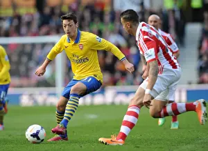 Stoke City V Arsenal 2013-14 Prints: Mesut Ozil vs. Geoff Cameron: Clash at Britannia Stadium - Stoke City vs