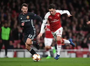 Arsenal V CSKA Moscow 2017-18 Prints: Mesut Ozil vs. Georgi Schennikov: A UEFA Europa League Battle