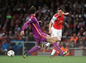 Arsenal V Galatasaray 2014/15 Champions League Prints: Mesut Ozil vs Hamit Altintop: Intense Battle in Arsenal's Champions League Clash with Galatasaray