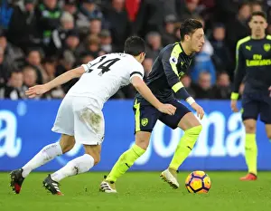 Swansea City V Arsenal - 2016-17 Prints: Mesut Ozil vs Jack Cork: A Premier League Showdown at Swansea City