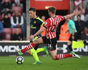 Southampton V Arsenal 2016-17 Prints: Mesut Ozil vs Jack Stephens: Intense Battle in Southampton v Arsenal Premier League Clash