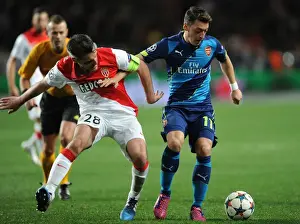 Monaco V Arsenal 2014/15 Prints: Mesut Ozil vs. Jeremy Toulalan: Intense Battle in Monaco's UCL Clash Against Arsenal