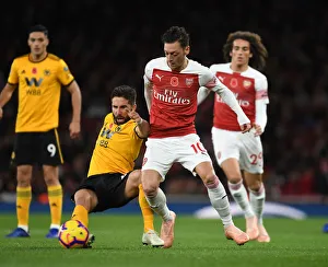 Arsenal V Wolverhampton Wanderers 2018-19 Prints: Mesut Özil vs. João Moutinho: Arsenal vs