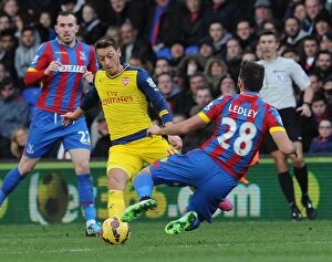 Images Dated 21st February 2015: Mesut Ozil vs Joe Ledley: Intense Battle at Crystal Palace vs Arsenal, Premier League 2014-15
