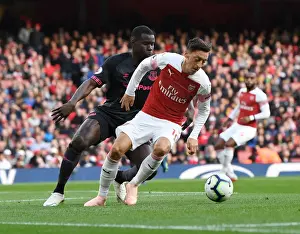 Arsenal V Everton 2018-19 Prints: Mesut Ozil vs Kurt Zouma: Battle at Emirates Stadium - Arsenal v Everton