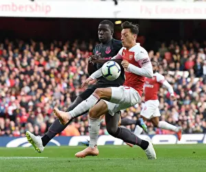 Arsenal V Everton 2018-19 Prints: Mesut Ozil vs. Kurt Zouma: Battle at Emirates Stadium - Arsenal v Everton