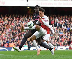 Arsenal V Everton 2018-19 Prints: Mesut Ozil vs Kurt Zouma: A Midfield Duel at Emirates Stadium - Arsenal vs Everton