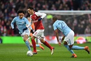 Images Dated 25th February 2018: Mesut Ozil vs Leroy Sane: Clash of the Stars in the Arsenal v Manchester City Carabao Cup Final