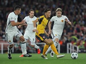 Arsenal v FC Basel 2016-17 Collection: Mesut Ozil vs Marek Suchy: A Battle in Arsenal's UEFA Champions League Clash with FC Basel