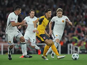 Arsenal V FC Basel 2016-17 Prints: Mesut Ozil vs Marek Suchy: A Battle in Arsenal's UEFA Champions League Clash with FC Basel