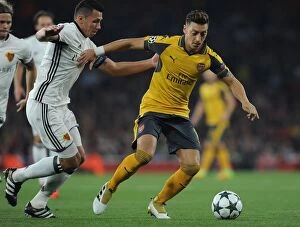 Images Dated 28th September 2016: Mesut Ozil vs Marek Suchy: A Battle at the Emirates - Arsenal FC vs FC Basel UEFA Champions League