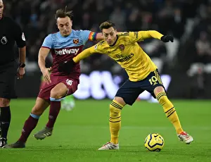Mesut Ozil vs Mark Noble: Intense Battle at London Stadium - West Ham United vs Arsenal FC, Premier League 2019-20