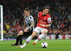 Arsenal V Newcastle United 2013/14 Prints: Mesut Ozil vs. Mathieu Debuchy: Clash at the Emirates