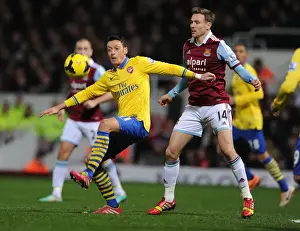 West Ham United V Arsenal 2013-14 Prints: Mesut Ozil vs Matt Taylor: Battle at the Boleyn Ground - Arsenal vs West Ham United