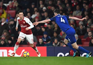 Arsenal V Everton 2017-18 Prints: Mesut Ozil vs Michael Keane