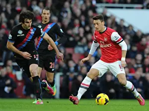 Arsenal V Crystal Palace 2013-14 Prints: Mesut Ozil vs. Mile Jedinak: Clash at the Emirates - Arsenal v Crystal Palace