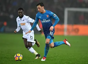 Swansea City V Arsenal 2017-18 Prints: Mesut Ozil vs. Nathan Dyer: A Premier League Battle at Swansea's Liberty Stadium (Arsenal vs)