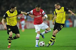 Borussia Dortmund V Arsenal 2013-14 Prints: Mesut Ozil vs. Neven Subotic: A Battle in the 2013-14 Borussia Dortmund vs
