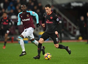 West Ham United V Arsenal 2017-18 Prints: Mesut Ozil vs Pedro Obiang: A Premier League Battle