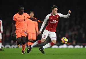 Arsenal V Liverpool 2017-18 Prints: Mesut Ozil vs. Sadio Mane: Intense Battle at Arsenal v Liverpool (2017-18)