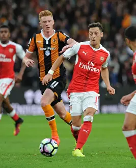 Hull City V Arsenal 2016-17 Prints: Mesut Ozil vs Sam Clucas: A Battle of Wits in the Premier League