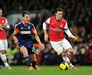 Arsenal V Fulham 2013-14 Prints: Mesut Ozil vs. Scott Parker: Clash at the Emirates - Arsenal v Fulham