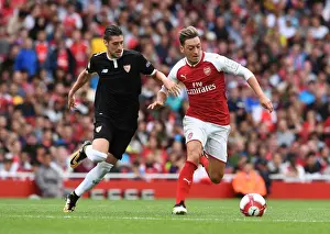 Arsenal V Seville - Emirates Cup 2017-18 Prints: Mesut Ozil vs. Sergio Escudero: Clash at the Emirates Cup