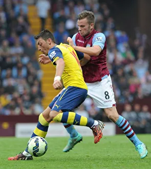 Aston Villa V Arsenal 2014-15 Prints: Mesut Ozil vs. Tom Cleverley: Clash at Villa Park, 2014-15 Premier League