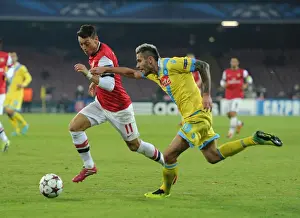 Mesut Ozil vs Valon Behrami: A Battle in the UEFA Champions League between Napoli and Arsenal