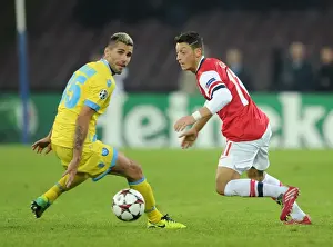 Napoli V Arsenal 2013-14 Prints: Mesut Ozil vs Valon Behrami: A Champions League Battle at Stadio San Paolo