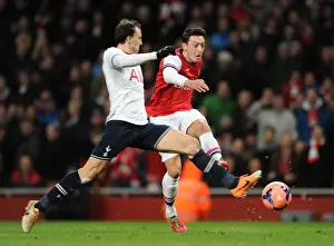 Arsenal V Tottenham Hotspur 2013-14 Prints: Mesut Ozil vs Vlad Chiriches: A Shooting Duel at the Arsenal vs Tottenham FA Cup Match