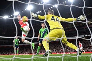 Arsenal v Southampton 2015-16 Collection: Mesut Ozil's Shot Stopped by Fraser Forster: Arsenal vs. Southampton, Premier League 2015-16