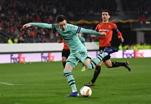 Stade Rennes V Arsenal 2018-19 Prints: Mesut Ozil's Standout Performance: Arsenal's UEFA Europa League Victory over Stade Rennais (2018-19)