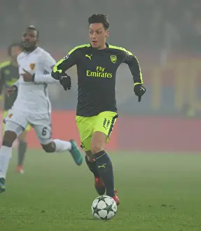 FC Basel V Arsenal 2016-17 Prints: Mesut Ozil's Standout Performance: Arsenal's Victory over FC Basel in the UEFA Champions League (2016)