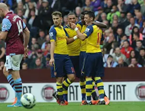 Aston Villa V Arsenal 2014-15 Prints: Mesut Ozil's Strike: Arsenal's Winning Moment Against Aston Villa (2014-15)