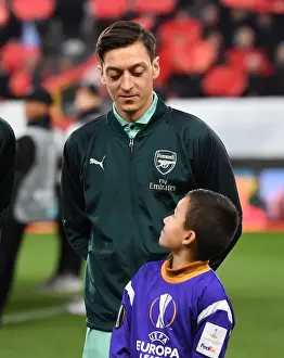 Mesut Ozil's Welcome: Arsenal Players Escorted at Stade Rennais, UEFA Europa League Round of 16 (First Leg)