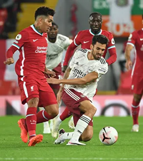 Midfield Showdown: Dani Ceballos vs. Roberto Firmino in Empty Anfield's Premier League Battle (2020-21)