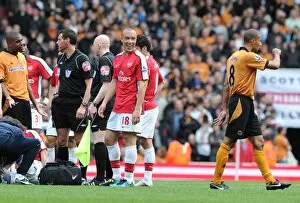 Mikael Silvestre (Arsenal) confronts Wolves captain Carl Henry after being sent off for a challenge on Tomas Rosicky