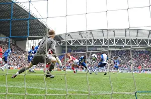 Wigan Athletic V Arsenal 2009-10 Prints: Mikael Silvestre heads past Wigan goalkeeper Chris Kirkland to score the 2nd Arsenal goal
